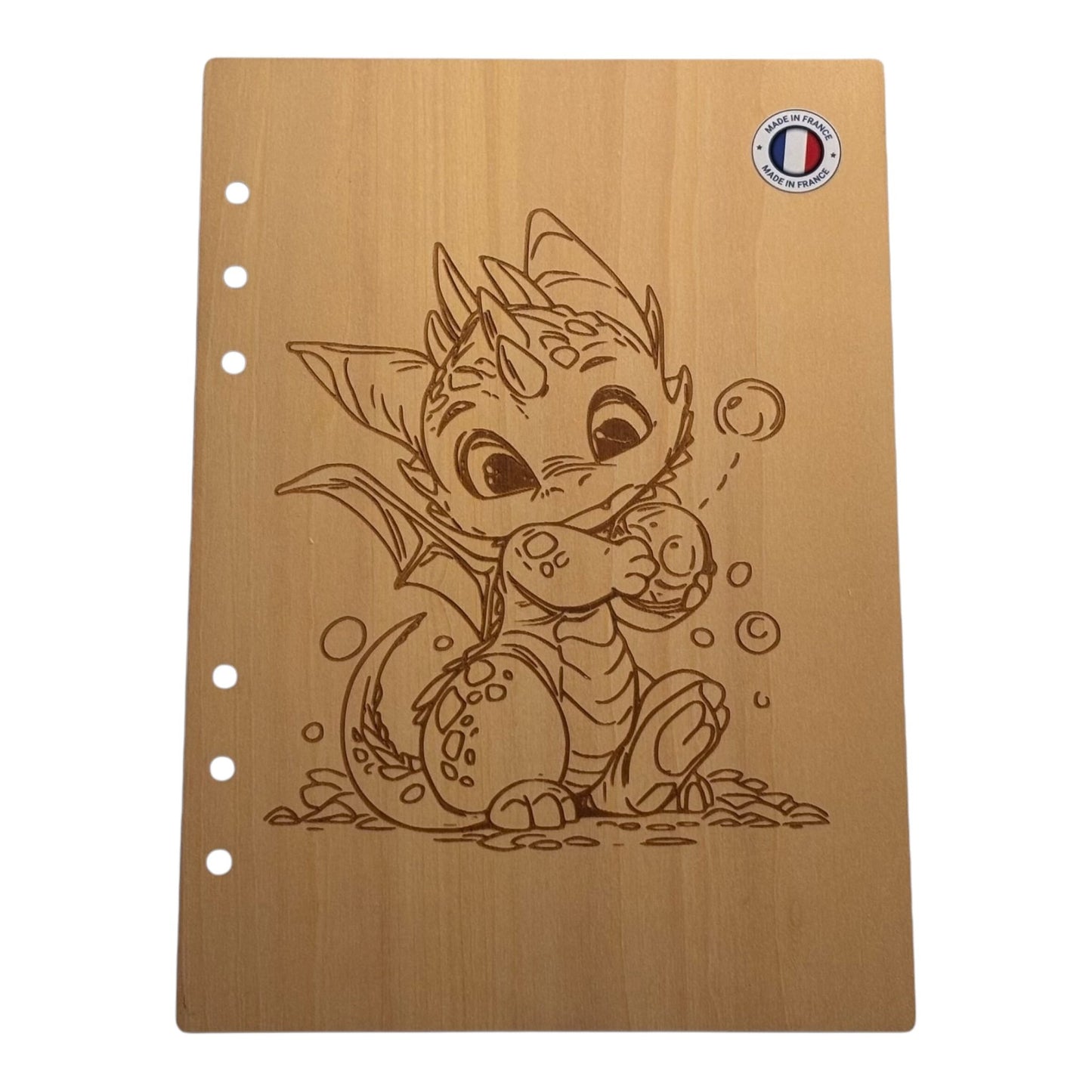 Couverture cahier A5 dragon avec une bulle dans les mains graver au laser rechargeable et ecologique fabrication francaise et artisanale